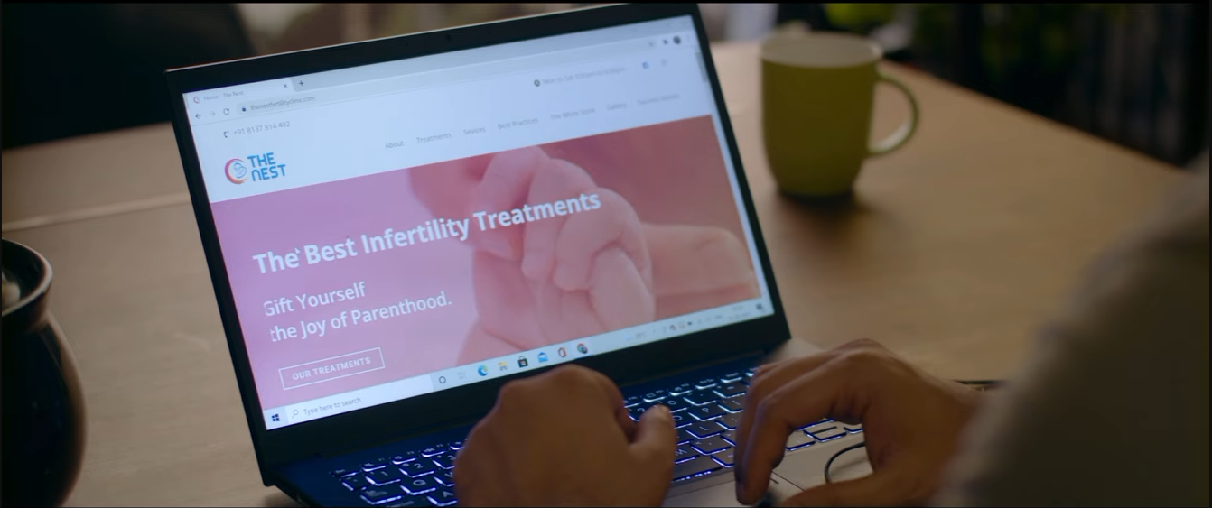 A patient exploring The Nest Fertility Clinic website on a laptop